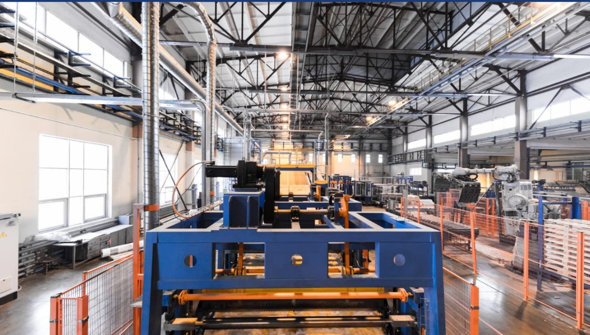 Automated production line with robotic arm on a factory floor